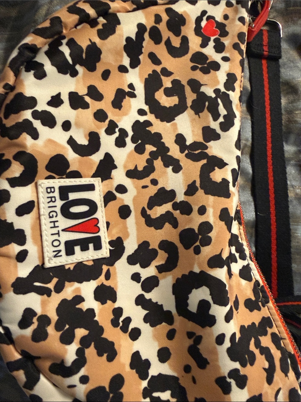 Brighton Leopard Print sling bag - Tan, Black & Red Accents